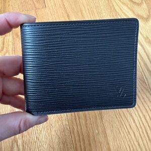 Brand New! Louis Vuitton Wallet. Black with LV stamp. Authentic with receipt!
